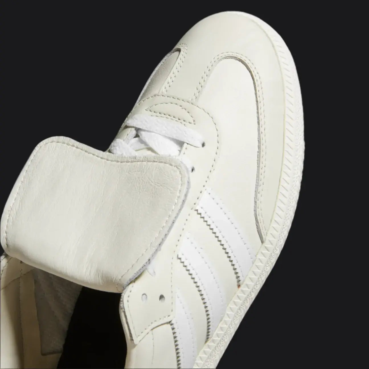 Close-up of a white sneaker on a white background
