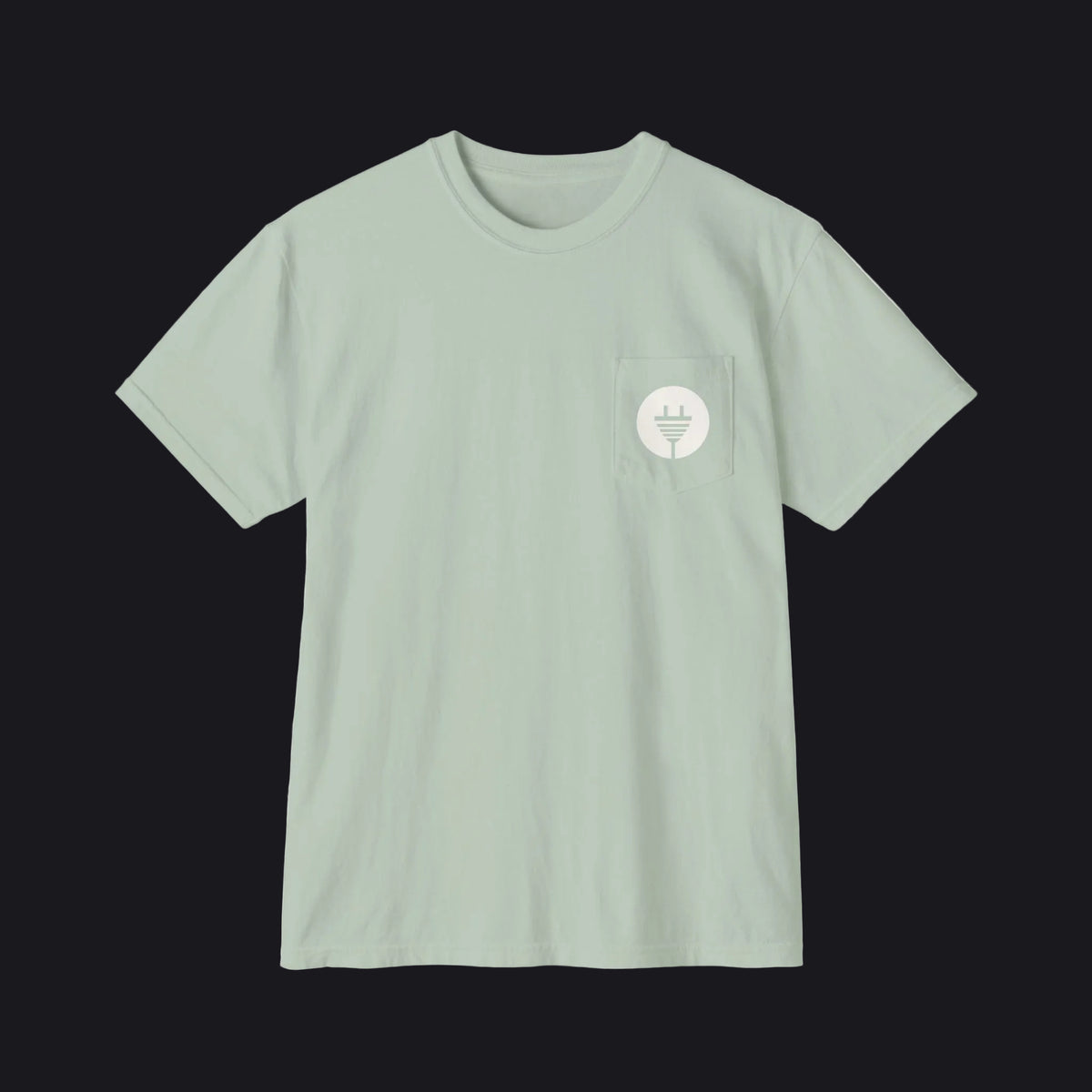 A sage green crewneck pocket t-shirt with a small white circular logo on the left chest pocket, displayed flat against a white background.