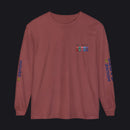 A long-sleeve crewneck t-shirt in a dusty rose or mauve color, featuring a small military-style ribbon graphic on the left chest, 'HOUSE 98' printed in blue on both sleeves, and a small yellow crown detail on the right sleeve cuff.