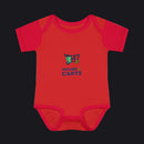 A red short-sleeve baby bodysuit with a colorful '7 40 HOUSE OF CARTS' graphic on the chest, displayed flat against a white background.