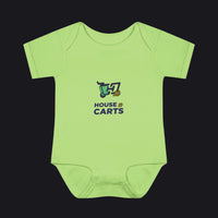 A light lime green short-sleeve baby bodysuit with a 'HOUSE OF CARTS' graphic printed on the chest, displayed flat against a solid white background.
