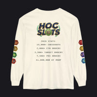 An off-white long-sleeve t-shirt with a graphic on the back reading 'HOC SLOTS 10' and various colorful hexagonal game dice printed down both sleeves, shown against a plain white background.