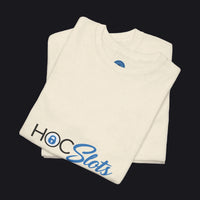 A folded cream-colored t-shirt with 'HOC Slots' printed on the front in black and blue, set against a plain white background.