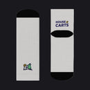 Two white socks with black circular patterns on a white background