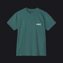 A dark teal green short-sleeve crewneck t-shirt with a left chest pocket featuring the white text 'HOC' printed on it, displayed against a solid white background.