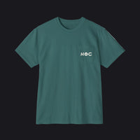 A dark teal green short-sleeve crewneck t-shirt with a left chest pocket featuring the white text 'HOC' printed on it, displayed against a solid white background.