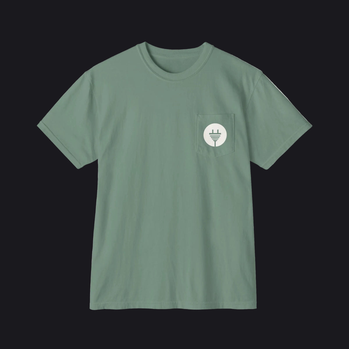 A sage green short-sleeve crewneck pocket t-shirt with a small white circular graphic on the chest pocket depicting a power plug.