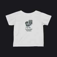 A light heather gray baby t-shirt with a dark teal graphic of a grill and the text 'MY DAD COOKS ON AND OFF THE GRILL' printed on the back.