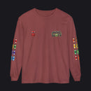 A long-sleeve crewneck t-shirt in a dusty rose or mauve color, featuring a 'HOC SLOTS' graphic on the left chest, a small red and white flag graphic on the right chest, and colorful flag graphics printed down both sleeves.