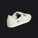 White Adidas sneaker on a white background