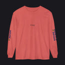 A coral pink long-sleeve t-shirt with 'tlrep' printed in black on the chest and 'HOUSE OF CARDS' printed vertically in blue and yellow on both sleeves, shown on a plain white background.
