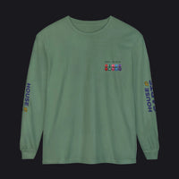 A sage green long-sleeve t-shirt with military-style ribbons printed on the left chest, 'HOUSE 82ND' printed vertically on both sleeves, and a small yellow '82ND' detail on the right sleeve, shown on a plain white background.