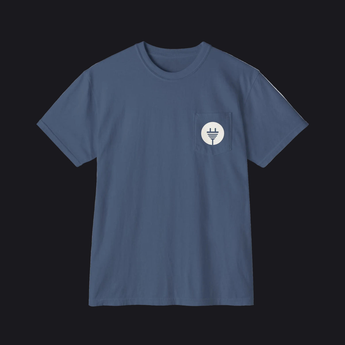 A slate blue crewneck pocket t-shirt with a small white circular chest graphic, displayed flat against a clean white background.