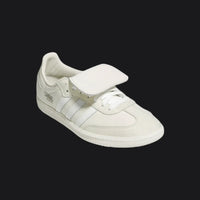 White sneaker with velcro straps on a white background